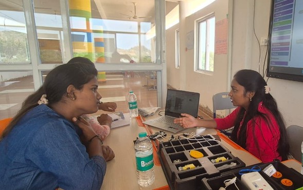 Teachers discussing electronics and coding activities