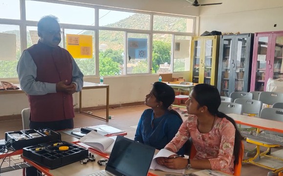Trainer guiding teachers through a STEM activity
